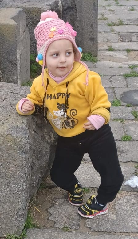 Elaf, a young girl smiling